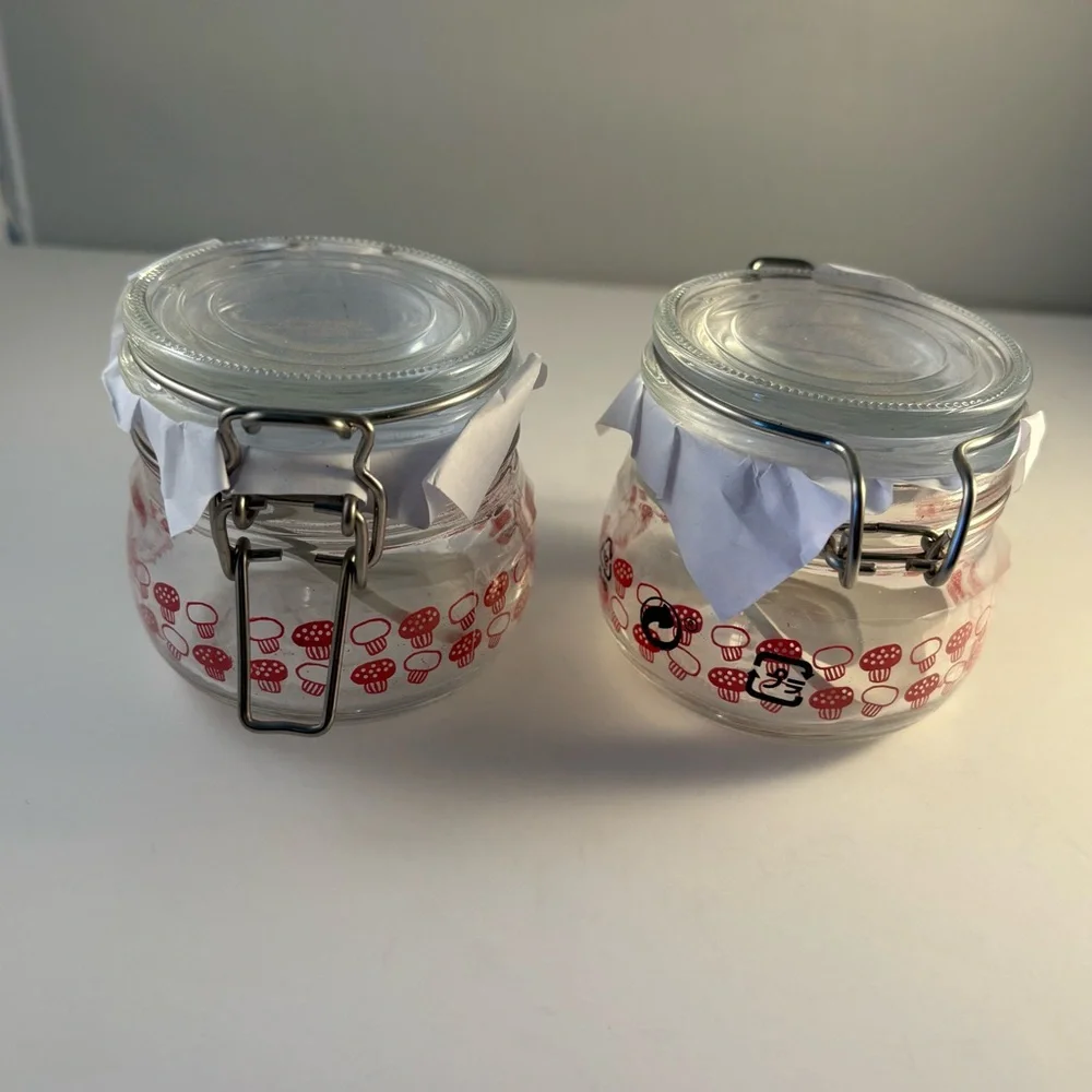 Lot Of 2 New IKEA KORKEN Jars Red Mushroom Print Glass Storage Seals Tight 2.75”